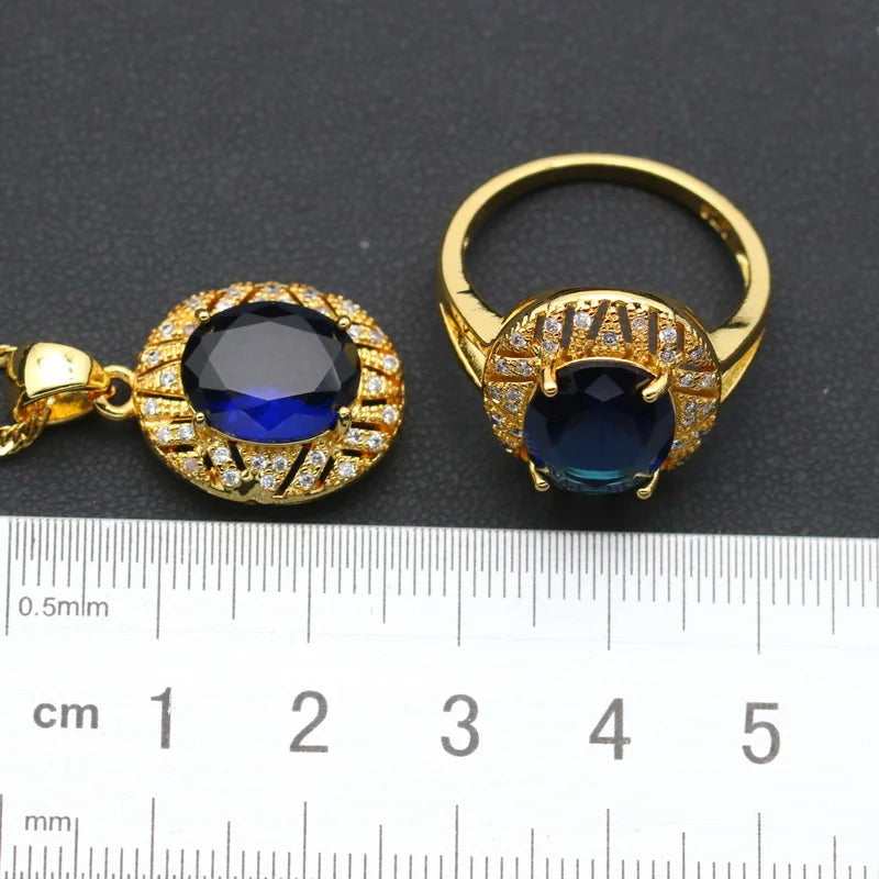 XOTICA Gold Plated Jewelry Set for Women Custom Blue Crystal Earrings Pendant Ring Necklace for Weddings and Parties