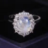 ArtistA Abiding 925 Sterling Silver White Cz Halo Oval Cut 8X10mm Milky Blue Moonstone Cluster Flower Ring Necklace Pendant Jewelry Set