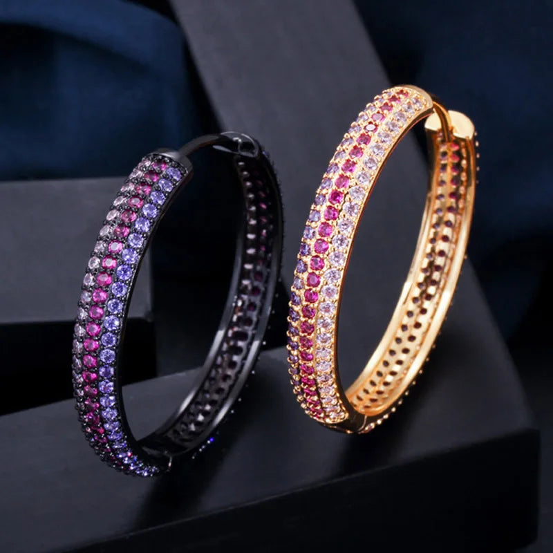 S&S Rainbow Double-Sided CZ Huggie Hoop Earrings – Gold & Black Gun Plated – Collection