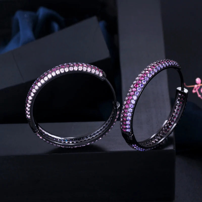 S&S Rainbow Double-Sided CZ Huggie Hoop Earrings – Gold & Black Gun Plated – Collection