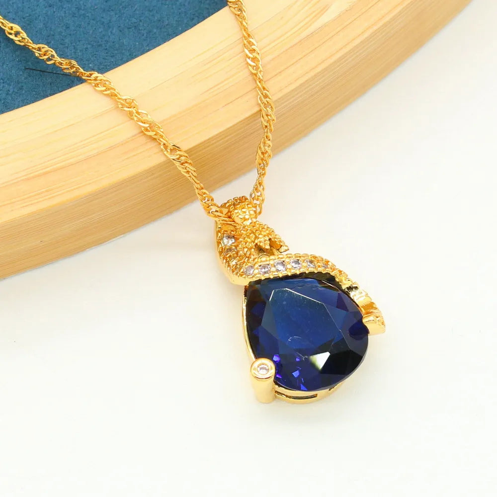 XOTICA Women's Gold Plated Bridal Sets Sapphire Blue Classic Alloy Stud Earrings Bracelet Pendant Necklace Ring for Engagement Wedding