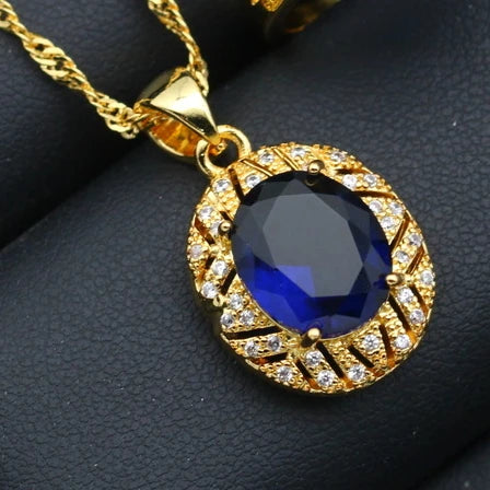 XOTICA Gold Plated Jewelry Set for Women Custom Blue Crystal Earrings Pendant Ring Necklace for Weddings and Parties