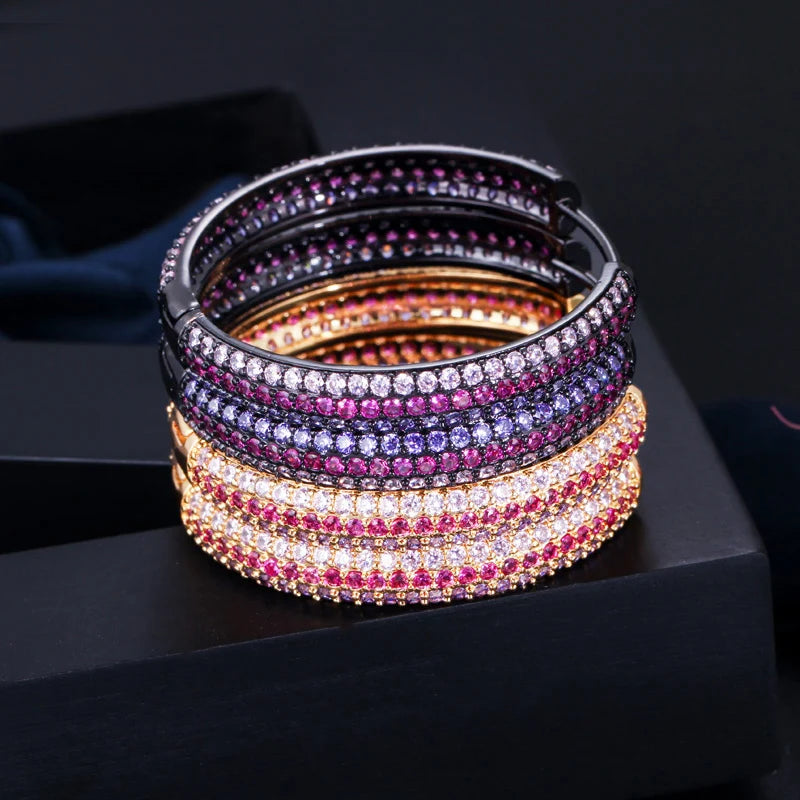 S&S Rainbow Double-Sided CZ Huggie Hoop Earrings – Gold & Black Gun Plated – Collection