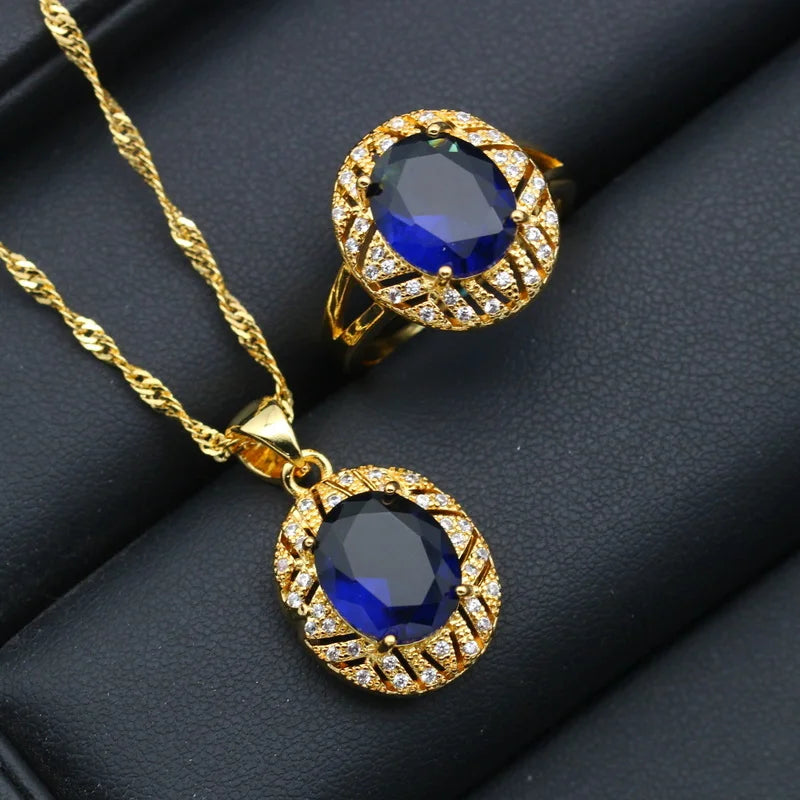 XOTICA Gold Plated Jewelry Set for Women Custom Blue Crystal Earrings Pendant Ring Necklace for Weddings and Parties