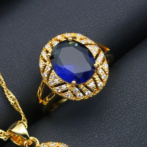 XOTICA Gold Plated Jewelry Set for Women Custom Blue Crystal Earrings Pendant Ring Necklace for Weddings and Parties