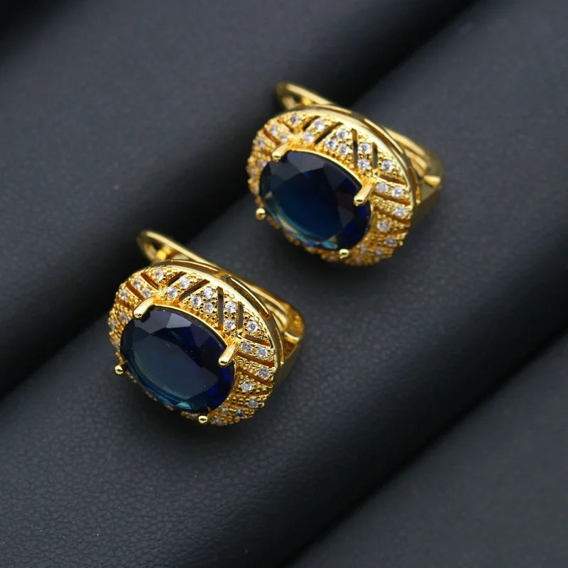 XOTICA Gold Plated Jewelry Set for Women Custom Blue Crystal Earrings Pendant Ring Necklace for Weddings and Parties