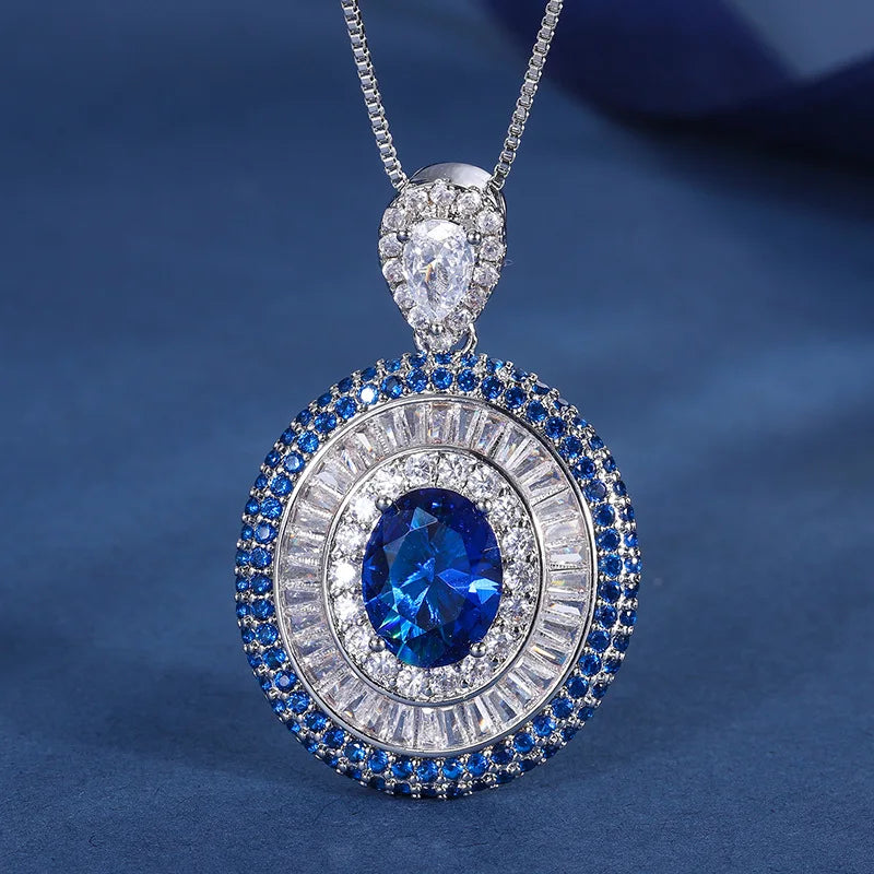 Gemfiori New Luxury Vintage Timeless Triple Layer Halo Design Jewelry Set for Women Oval Cut Blue Gem Halo Pendant Necklace Earrings Ring