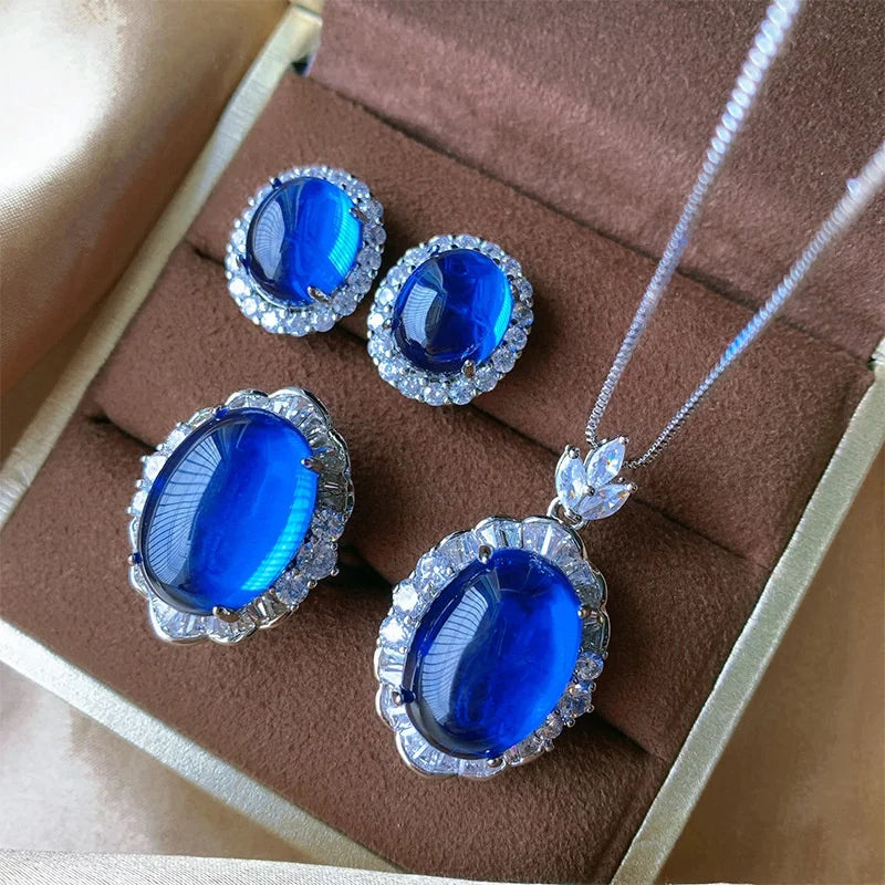 Gemfiori Luxury Pigeon Blood Ruby Jewelry Set Cabochon Cut Red Gem Halo Pendant Necklaces Earring Rings Timeless Classic Elegant Wedding