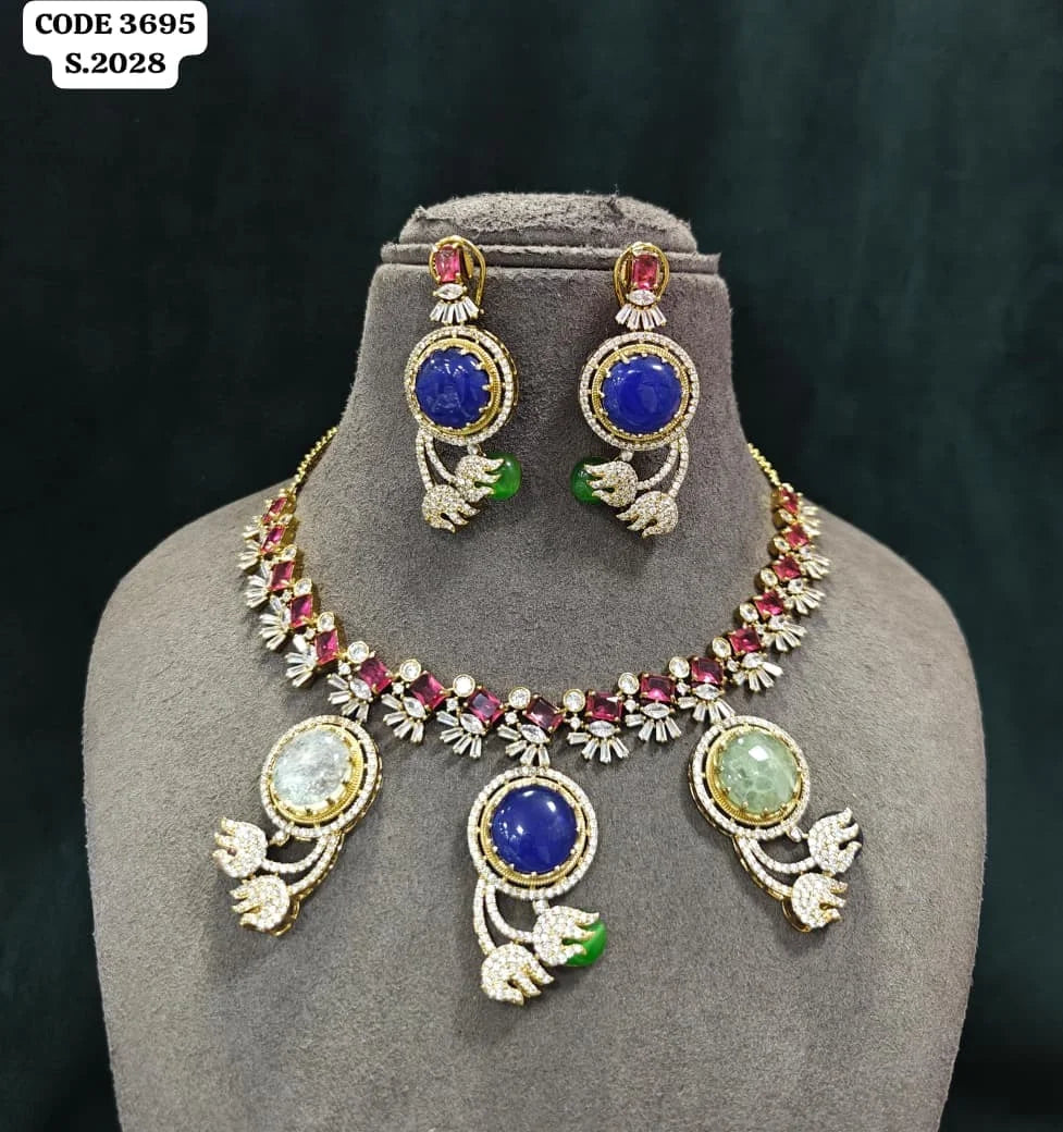 Luxury Designer Brass Necklace Set with Blue Round Stone, Green Accents, Gold Plated Party Wedding Jewellery Collection Set