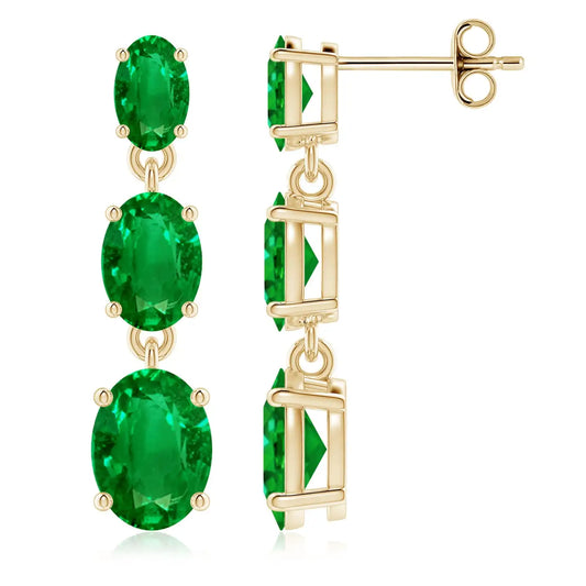 Elegant yellow gold emerald drop earrings featuring three graduated oval-cut emeralds in classic prong settings may birthstone